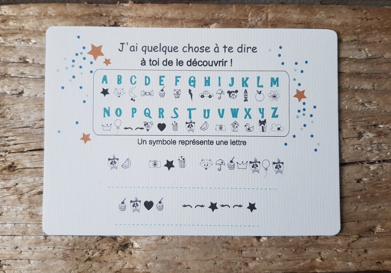 Carte symbole à décoder pour découvrir le message tu vas être papa