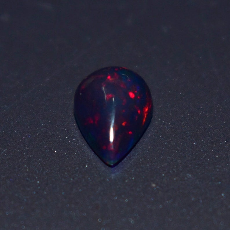 1.35 Cts 7x10 MM Natural Black Ethiopian Opal Cabochon Shape Pear Rainbow Fire Celebrated Opal Welo Fire Smooth Gemstone Opal Cabs Ring
