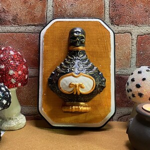 Mounted Skull Bottle Wall Plaque | Witch's Apothecary Series | Gothic Style | Halloween