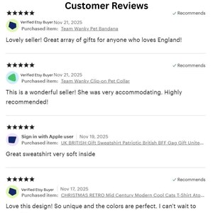 May include: A digital display of customer reviews featuring five-star ratings, user names, dates, and purchased item titles including Team Wanky Pet Bandana, Team Wanky Clip-on Pet Collar, UK British Gift Sweatshirt, and Christmas Retro Cool Cats T-Shirt.