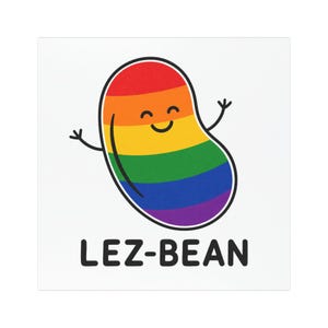 May include: A cartoon illustration of a bean in the colors of the rainbow flag, with a smiling face and arms raised. The text "LEZ-BEAN" is printed in black below the bean.