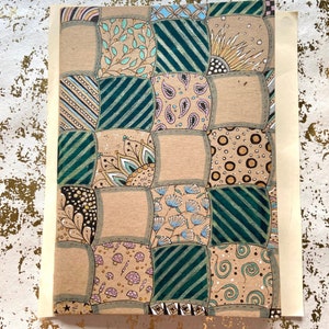 May include: Hand-drawn artwork with a patchwork design. Each square features a different pattern, including stripes, florals, and paisleys, in shades of green, brown, and gold. The artwork is on a beige background.