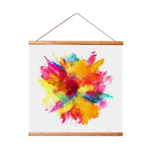 May include: A framed canvas print featuring a colorful explosion of powder paint in shades of red, yellow, blue, green, and pink. The print is displayed on a white background.