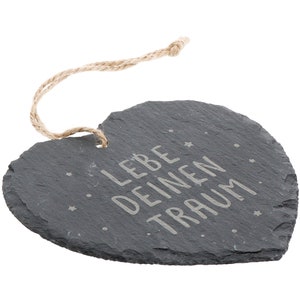 May include: A gray heart-shaped slate hanging ornament with a jute twine hanger. The slate has the text "LEBE DEINEN TRAUM" etched in white.