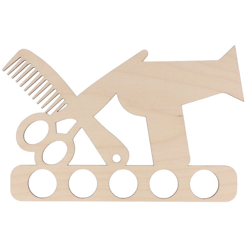 May include: A wooden wall-mounted organizer for hair styling tools. The design features cut-out silhouettes of a comb, scissors, and a hairdryer. It includes five circular holes for holding various items. The wood has a natural, unfinished appearance.