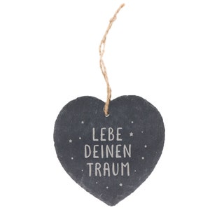 May include: A black heart-shaped slate hanging ornament with a twine string. The slate has the text "LEBE DEINEN TRAUM" written in white.
