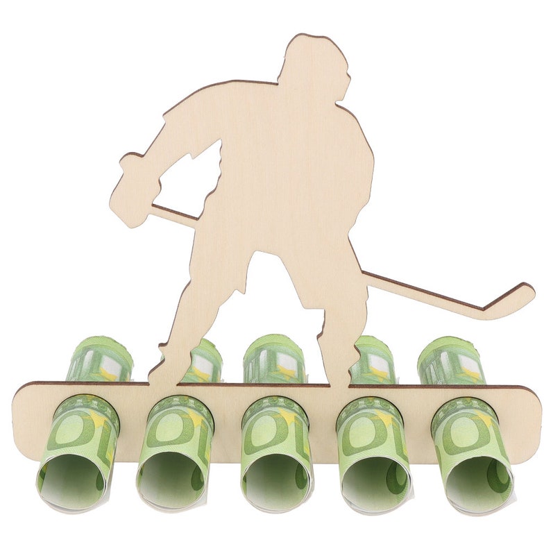 May include: Wooden hockey player money holder with five slots for euro bills. The player is holding a hockey stick and is standing on a wooden base.