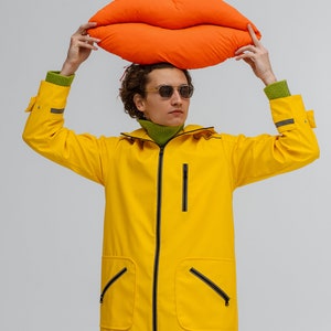 Unisex yellow hooded waterproof raincoat for travel and city
