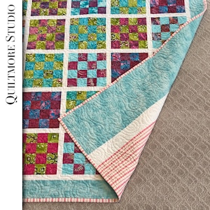 Lap quilt in bright cottons and batiks perfect for child/teenager.