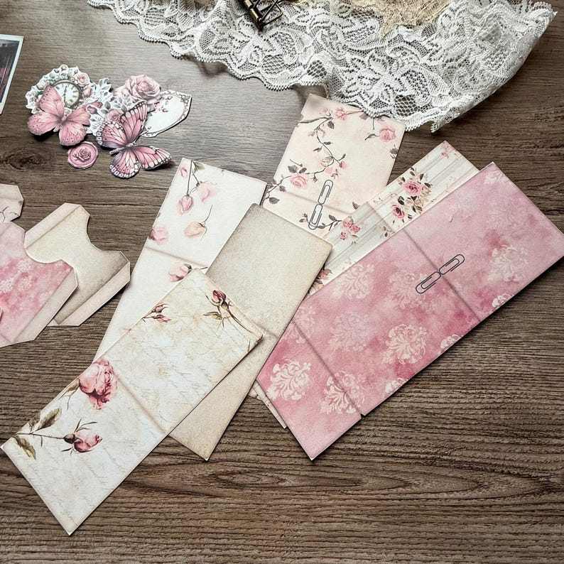Digital printable dusty rose hidden paperclip kit featuring vintage-inspired designs for junk journals, scrapbooking, and paper crafts. Includes floral and shabby chic patterns in soft pink tones, ideal for creating hidden paperclip embellishments, tags, and decorative journal accents. High-resolution JPEG and PDF files for easy printing and cutting. Perfect for romantic, vintage, and shabby chic crafting themes.