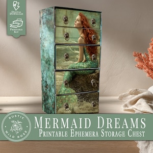 May include: A rustic-style storage chest with five drawers. The chest features a mermaid design on the front, with a red-haired mermaid sitting on a rock. The chest has ornate metal drawer pulls and the text "MERMAID DREAMS Printable Ephemera Storage Chest".