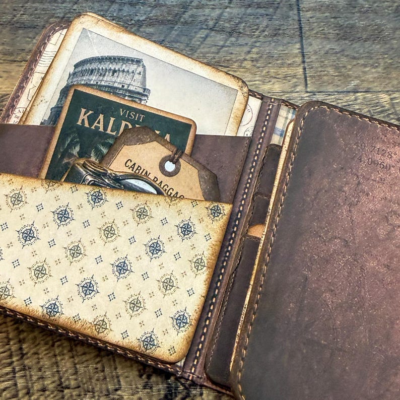 Printable traveler's wallet kit with vintage ephemera and antique maps for journaling.