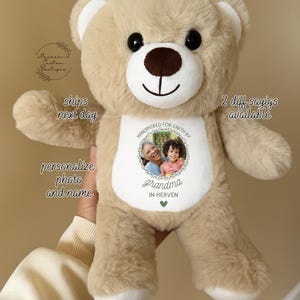 May include: A plush teddy bear in tan with a white muzzle and paws. The bear has a personalized photo and the text "Grandma in Heaven" on its chest. The bear is designed to be personalized with a photo and name.