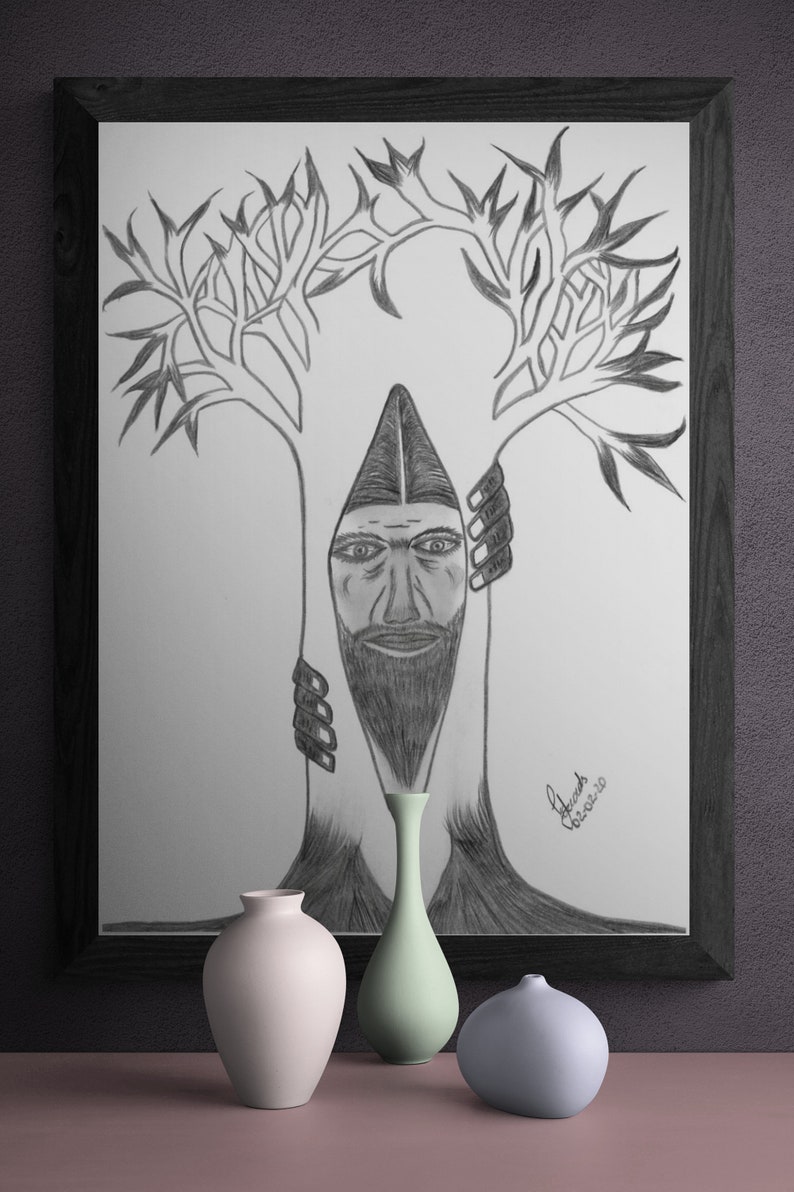 May include: A black and white pencil drawing of a man's face peeking out from behind a tree trunk. The tree has branches that reach up and out. The drawing is framed in a black frame and is sitting on a table with three vases.