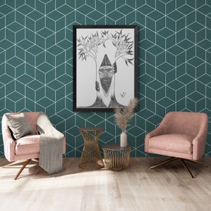 May include: A black framed drawing of a person's face with two trees growing out of their head. The drawing is hanging on a teal green wall with a white geometric pattern. Two pink armchairs and two gold metal side tables are in front of the drawing.