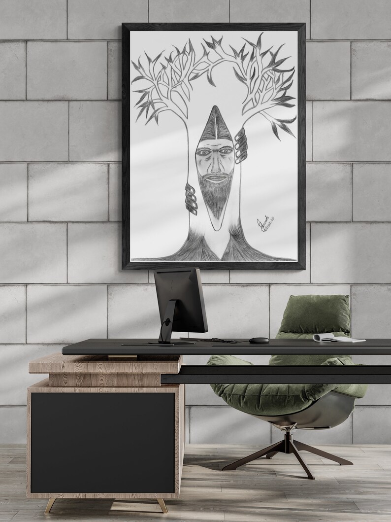 May include: A black and white pencil drawing of a man's face inside a tree. The drawing is framed and hanging on a white brick wall above a desk with a computer monitor, a green chair, and a wooden desk.