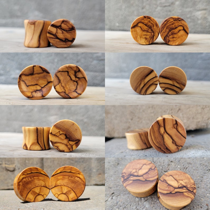 May include: A set of 10 wooden ear gauges in various sizes and patterns. The gauges are made of olive wood and have a natural, rustic finish.
