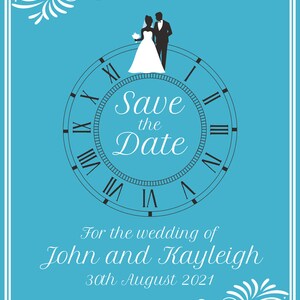 May include: A blue save the date card with a white clock face and roman numerals. The clock face has a silhouette of a bride and groom standing on top of it. The text "Save the Date" is written in a cursive font. The text "For the wedding of John and Kayleigh" is written below the clock. The date "30th August 2021" is written below the names.