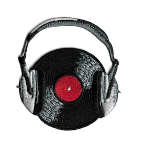 May include: Embroidered patch featuring a black vinyl record with a red center and silver headphones. The headphones are arched over the record. The patch is on a white background.