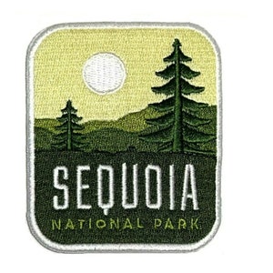 May include: Embroidered patch featuring a landscape scene with a large evergreen tree, a smaller tree, and a white circle representing the sun. The text "SEQUOIA NATIONAL PARK" is displayed in white letters on a dark green background.