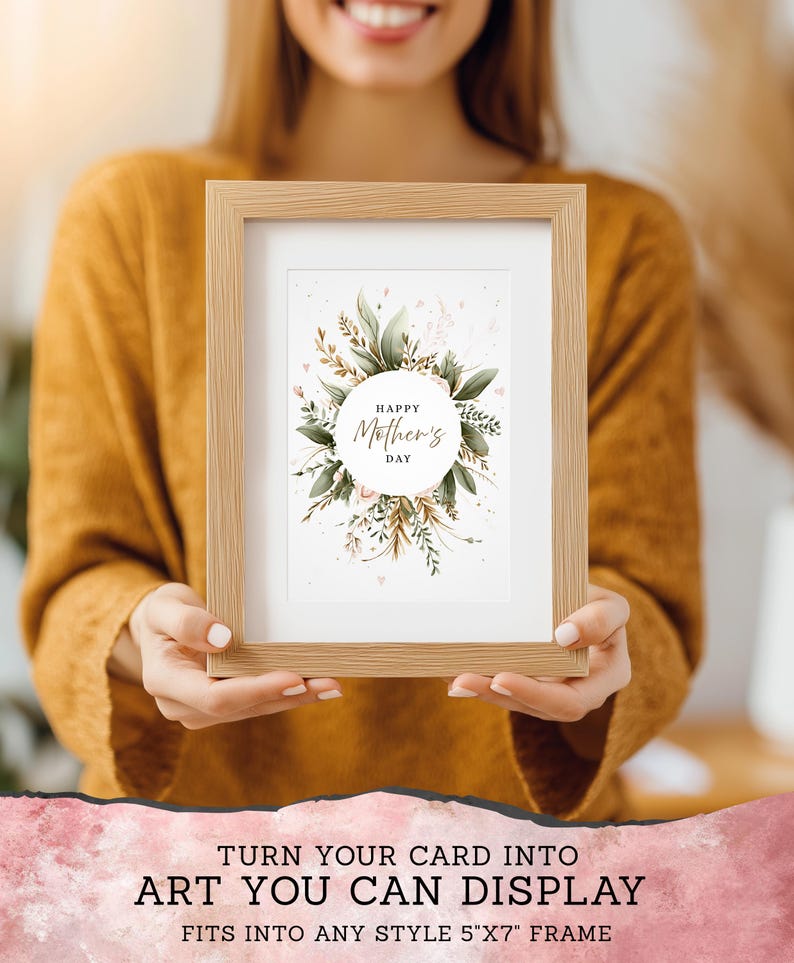 May include: A framed print with the text "Happy Mother's Day" surrounded by green leaves and pink accents. The frame is light brown and holds a 5"x7" print. The image also includes the text "TURN YOUR CARD INTO ART YOU CAN DISPLAY".