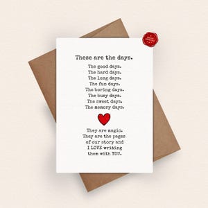May include: A white greeting card with black typewriter-style text that reads: These are the days. The good days. The hard days. The long days. The fun days. The boring days. The busy days. The sweet days. The memory days. A red heart and more text.