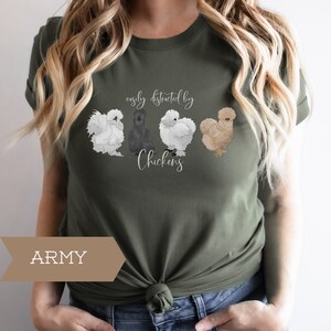 May include: A green t-shirt with the text "easily distracted by chickens" and a graphic of four chickens. The t-shirt is labeled "ARMY".
