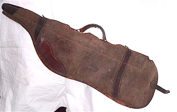 old hunting rifle case in waxed canvas and leather from the 70s