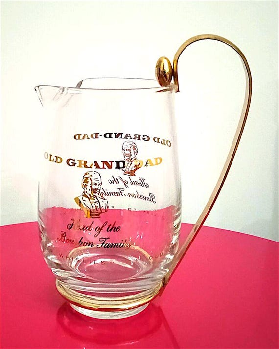 splendid advertising jug in glass and gold metal of the Bourbon OLD GRAND DAD from the 60s