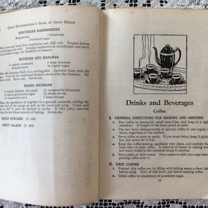 May include: A vintage cookbook with a black and white illustration of a teapot and cups on a tray. The text on the page reads "Drinks and Beverages" and "Coffee".