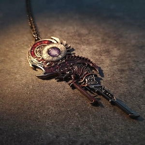 May include: A silver and bronze key pendant necklace with a clock face and intricate details. The clock face has a purple and white design.