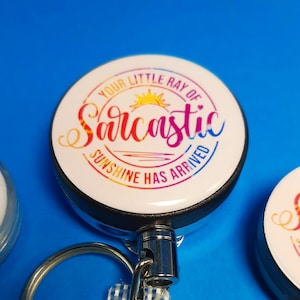Badge Reel Your Little Ray Of Sarcastic Sunshine Has Arrived - Stethoscope ID Tags                                       BR-B1004A