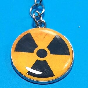 Charm Radiological Sign - 1" or 1.25" Design - Badge Reel Charm - Radiation Hazard          t   CH-B1001B