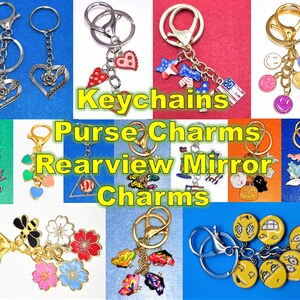 May include: Assortment of keychains, purse charms, and rearview mirror charms. The charms are made of metal and feature various designs, including hearts, stars, butterflies, and smiley faces.