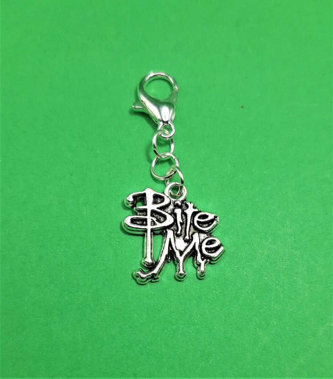 Silver Bite Me Badge Reel Charm Accessory Zipper Pull Cell Phone