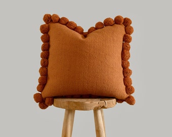 Rustic  handmade Boho Orange Pillow Cover with Woven Pom Poms