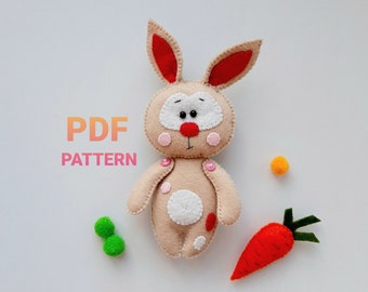 May include: PDF pattern for a felt bunny toy. The bunny is beige with red ears, pink cheeks, and white spots. The pattern includes instructions for sewing the bunny.