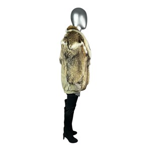 May include: A fur coat with a mix of brown, tan, and white fur. The coat has a collar and a patterned lining. The mannequin is wearing black thigh-high boots.