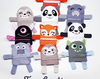 May include: Ten different animal-shaped zipper pouches with embroidered details. The pouches are made of fabric and have a variety of colors and patterns. The text "Taschentiere" is written in a decorative font at the bottom of the image. The text "für den 10x10er Rahmen, 10 tolle Motive, himbeerdesign | gewerbliche Nutzung inklusive" is also written at the bottom of the image.