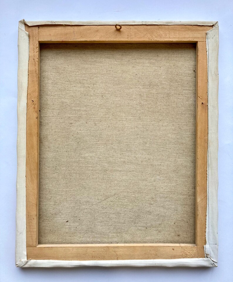 May include: A wooden frame with a canvas stretched over it. The canvas is a light beige color and has a textured surface. The frame is a light brown color and has a white border around the edge.