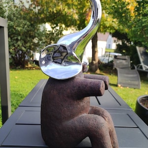 Abstract handcrafted art. Decorative Elephant Sculpture/Statue, patinated polyresin body with wood look, chrome-finish head. Height 30 cm
