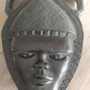 African mask in carved ebony wood. Tribal. Vintage