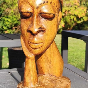 African Artisanal Art/Bust of the Thinker in wood. Black highlights. High 24 cm