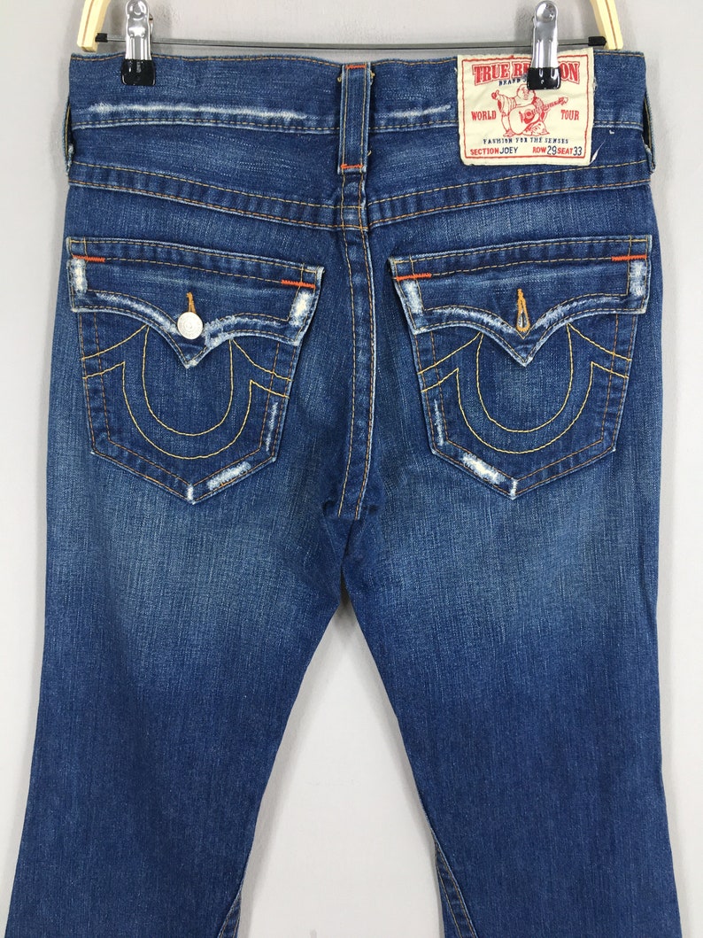 May include: A set of three ceramic mugs with a speckled, matte finish. The mugs are in shades of cream, light gray, and dark gray. Each mug has a simple, minimalist design, perfect for coffee or tea.