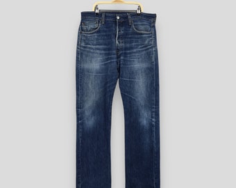 Jeans Levi's 501 sbiaditi blu vintage anni '90, jeans Levi's dritti con lavaggio chiaro, jeans Levi's 501 con bottoni e patta, jeans Levi's Usa W34