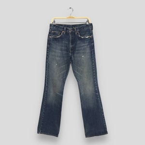 Talla 29x31 Vaqueros acampanados Levi&#39;s 517 vintage con corte de bota, denim lavado claro, vaqueros Levi&#39;s lavados a la piedra de los años 90, vaqueros Levi&#39;s desgastados con cremallera W29