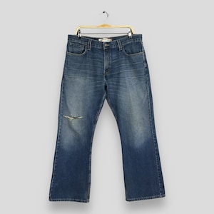 Talla 34x29 Vaqueros Levi&#39;s 527 de corte bajo vintage, denim lavado claro, vaqueros Levi&#39;s lavados a la piedra de los años 90, vaqueros Levi&#39;s desgastados con cremallera, W34