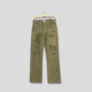Vaqueros Levi&#39;s 501 vintage, desgastados, rotos, verde oliva, de los años 90. Vaqueros Levi&#39;s 501 deslavados claros. Vaqueros Levi&#39;s 501 descoloridos, rotos, 28 x 29.
