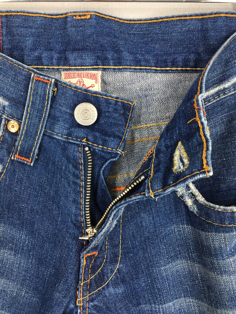 May include: A set of three ceramic mugs with a speckled, matte finish. The mugs are in shades of cream, light gray, and dark gray. Each mug has a simple, minimalist design, perfect for coffee or tea.