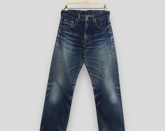 Vintage Levi's 502 Big E Japan Jeans Levi's Ripped Dirty